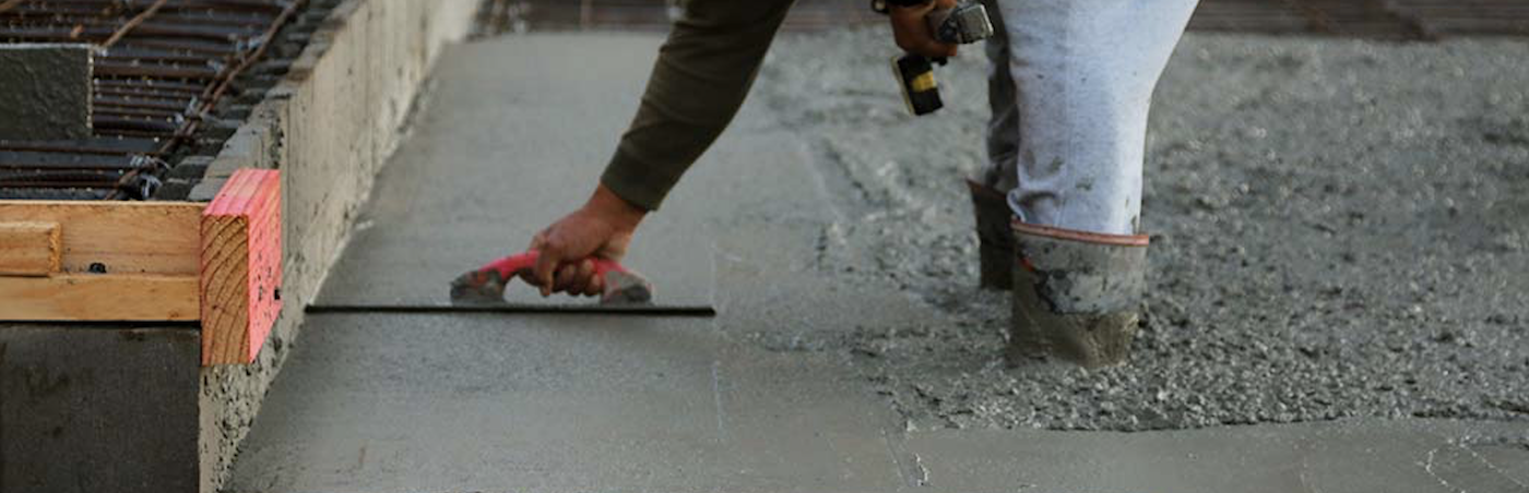 man laying cement